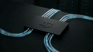 Fiber optic cables going through a switchboard marked with the Teams logo.